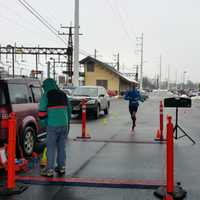 <p>Kevin Hoyt crosses the finish line to win the race with a time of 1:09:08.</p>