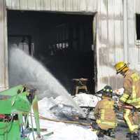 <p>Firefighters spent Tuesday afternoon battling a blaze at a farm in Southeast.</p>