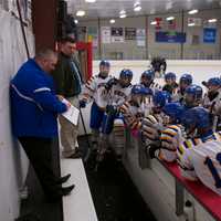 <p>Mahopac coach Chris Lombardo instructs his team during timeout.</p>