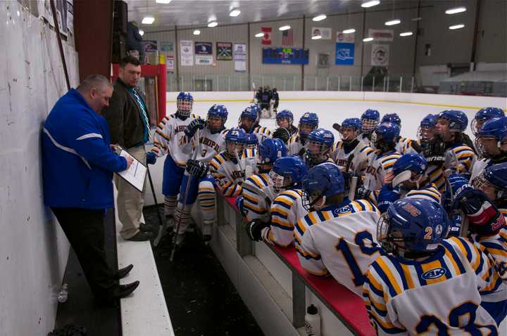 Mahopac coach Chris Lombardo instructs his team during timeout.