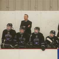 <p>John Jay bench looks on at action.</p>