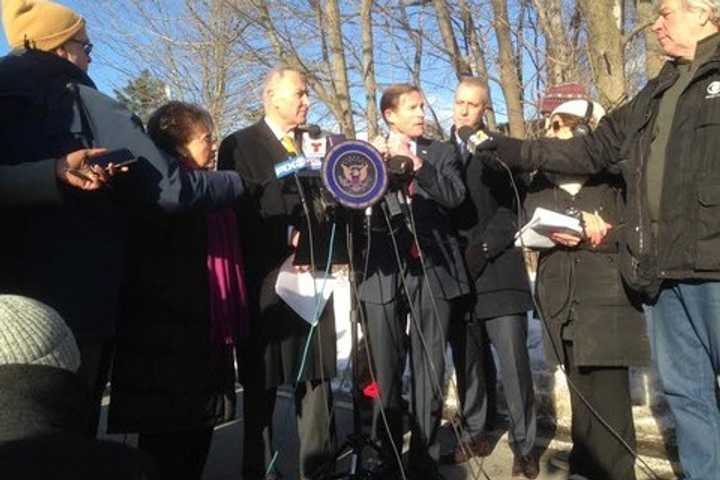 U.S. Sens. Charles Schumer and Richard Blumenthal, seen here after visiting the wreckage of the Metro-North car that hit an SUV at a grade crossing. The two have proposed new legislation to improve crossing safety.