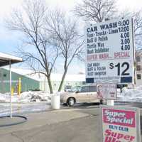 <p>A steady stream of cars lined up at 301 Boston Post Road, a block from I-95 and I-287 in Port Chester, where car washes start at $9.</p>