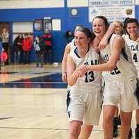 <p>Westlake&#x27;s Faith Lovett (13) and Katie Schmid (22) hug after defeating Valhalla, 59-38.</p>