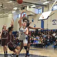 <p>WHS Natalie Alfieri squeezes through  for layup.</p>