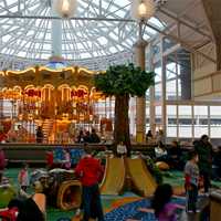 <p>The large play area and carousel are packed during Saturday&#x27;s snow.</p>