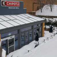 <p>Outdoor seating at Chipotle Grill is buried in snow at the Danbury Fair Mall.</p>