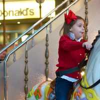 <p>Riding the carousel.</p>