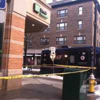 <p>Police placed crime scene tape around the Greenwich bank.</p>