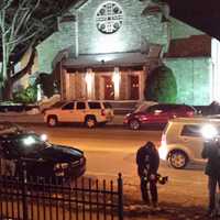 <p>Television crews and police outside Wednesday&#x27;s vigil in Harrison.</p>