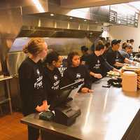 <p>A customer prepares to order at the new Salsa Fresca in Danbury with the newly trained employees ready to go. </p>