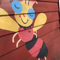 <p>The red bee on the side of the Weston home where Carla Marina Marchese works.</p>