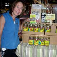 <p>Barb Kobren stands next to a display at Murray&#x27;s Cheese Shop. </p>