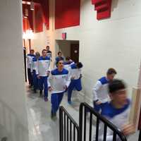 <p>The Haldane boys varsity team warmed up in the hallways of the Westchester County Center.</p>