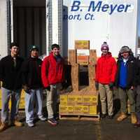 <p>Volunteers stack up Girl Scout cookies for delivery to troops on Saturday in East Norwalk. </p>