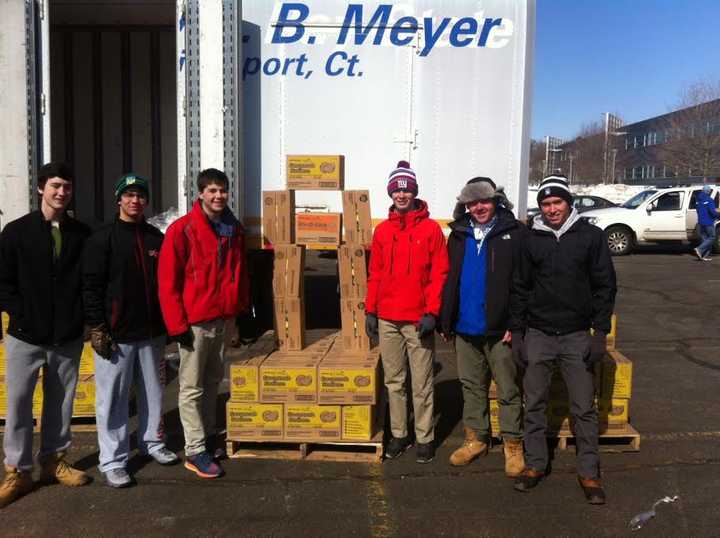 Volunteers stack up Girl Scout cookies for delivery to troops on Saturday in East Norwalk. 