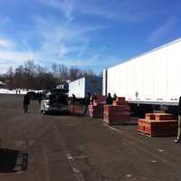 <p>Four tractor-trailers filled with cookies set up at Norden Place, the largest depot spot for Girl Scouts in Connecticut. </p>