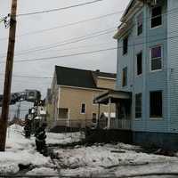 <p>Bridgeport firefighters douse the blaze at a three-story multifamily home on Wednesday afternoon.</p>