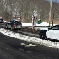 <p>A vehicle was reported to have gotten stuck at a grade crossing in Chappaqua, backed up and broke off a gate, which is pictured at center.</p>