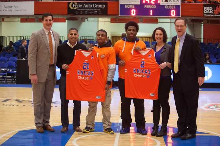 Marc Miller, director, marketing partnerships, WC Knicks; Eddie Lopez, territory sales manager, Crush; 2 children from Childrens Village; Lia Schwartz, senior communications officer,Childrens Village; Bill Boyce, VP sales &amp; business ops, WC Knicks.