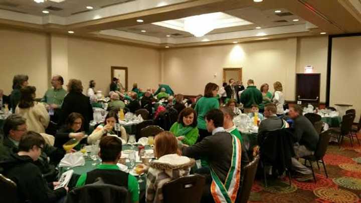 Parade participants dig in at the St. Patrick&#x27;s Day breakfast Tuesday at the Bridgeport Holiday Inn. 