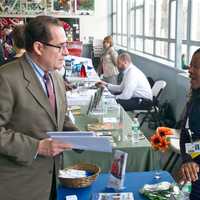 <p>National Health Care Associates talks business with a visitor. </p>