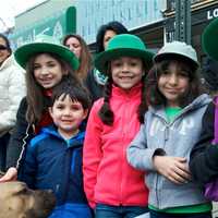 <p>A festive looking group of kids watches the parade.</p>