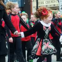 <p>Irish dancer in festive outfit.</p>