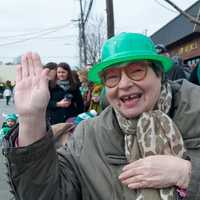 <p>A spectator waves hello at the 2015 Yonkers St. Patrick&#x27;s Day Parade.</p>