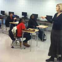 <p>Catherine Brackett leads a &quot;College Forum&quot; class at Wright Technical High School. The Grade 9 students earn a free NCC credit once they complete it successfully.</p>