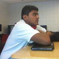 <p>Jorge Sanchez listens attentively during the College Forum class at Wright Technical High School. Students in the class receive one NCC credit for free if they successfully pass the class.</p>