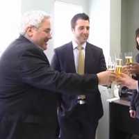 <p>Tuckahoe Mayor Steve Ecklond welcomes officials from Hertz with a toast in their honor.</p>