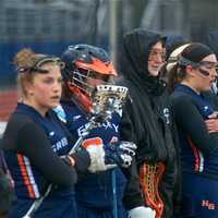 <p>Greeley players watch from sideline. </p>