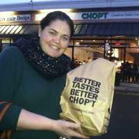 <p>Abigail Fox, of Old Greenwich, happily shows off her salad at the opening of Chop&#x27;t Wednesday in Riverside. The restaurant held a special opening Wednesday as it raised funds for a Greenwich-based charity.</p>