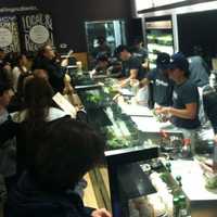 <p>Happy and patient customers at the opening of Chop&#x27;t Wednesday in Riverside. </p>