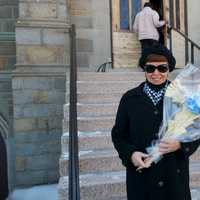 <p>Parishioners leave church with palms on Palm Sunday.</p>