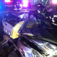 <p>The driver was trapped in this severely damaged car after a crash early Monday on Black Rock Turnpike near Burroughs Road in Fairfield. </p>