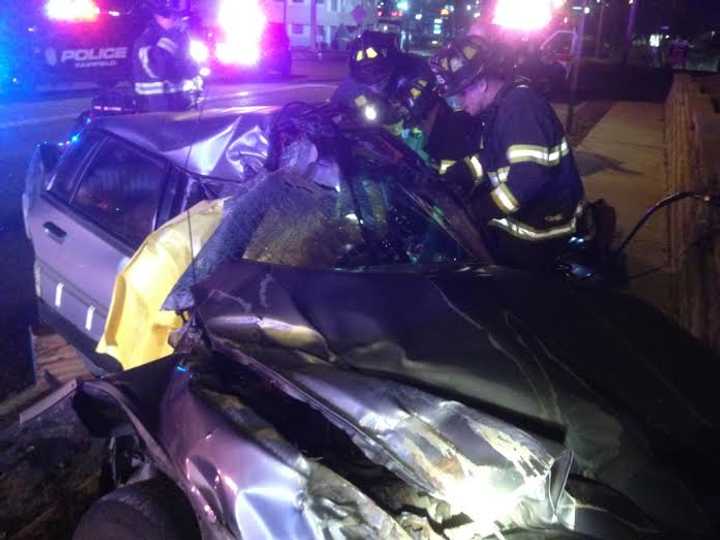 The driver was trapped in this severely damaged car after a crash early Monday on Black Rock Turnpike near Burroughs Road in Fairfield. 