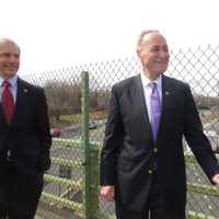 <p>U.S. Sen. Charles Schumer standing on an I-95 overpass pointed toward the location of a possible Connecticut toll plaza less than a mile away.</p>