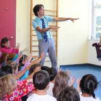 <p>Pre-school campers get ready for Mario the Magician to start the magic.

 </p>