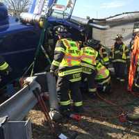 <p>Fairfield firefighters work to free the truck driver. </p>