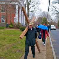 <p>The Rev. Dale Rosenberger leads off the Cross Walk in Darien on Good Friday.</p>