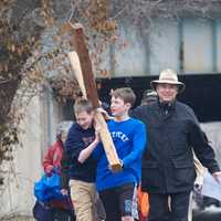 <p>Alex Armstrong (L), 12, and Owen Sheed, 13, of Darien, take a turn carrying the heavy cross.</p>