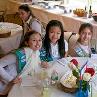 <p>Girls Scouts sit down for lunch with town officials. </p>