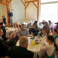 <p>The Girl Scouts enjoy lunch with town officials.</p>