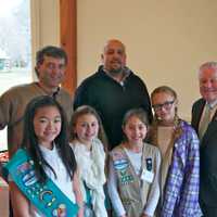 <p>Carlos Menteiro (back left), of the Public Works Department, Jeff Minder (back center), the Town Tree Warden, and Fairfield First Selectman Michael Tetreau enjoy lunch with the Girl Scouts.</p>