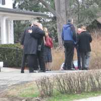 <p>Mourners console each other at Lacey Carr&#x27;s wake.</p>