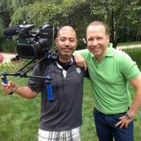 <p>Mar Jennings, right, of Westport joins a cameraman.</p>