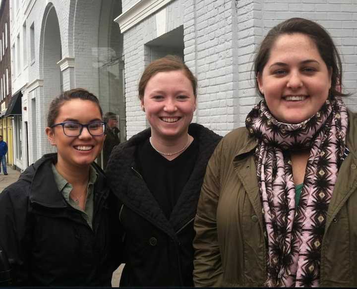 Julia Vos, 23, at right will have to wait until June for her new Apple Watch due to huge sales of the  watch. Joining her 