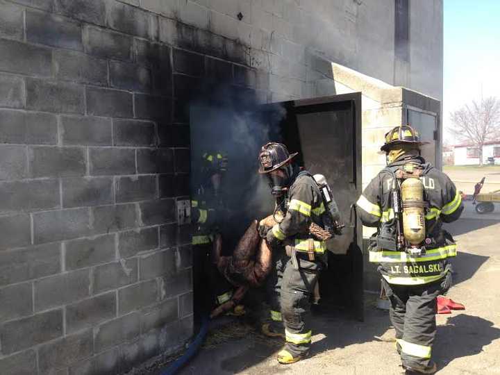 Farifield firefighters &#x27;rescue&#x27; a mannequin during a training exercise Monday at the Joseph Elias Training Fire Training Center.